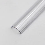 The Diffuser for Alu-Round profile is a clear, semi-circular plastic piece shown resting on a plain white surface with its open side facing down and both ends visible.