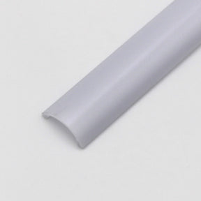 A close-up of the Diffuser for Alu-Round profile, a white semi-circular plastic cable cover strip, displayed on a plain light background.