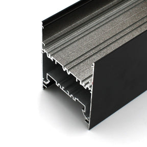 Close-up view of the Direct/Indirect Linear Pendant Lighting LED Channel ~ Model DPL70FL, a black aluminum extrusion with inner channels and grooves, ideal for construction or framing and offering superior heat dissipation.