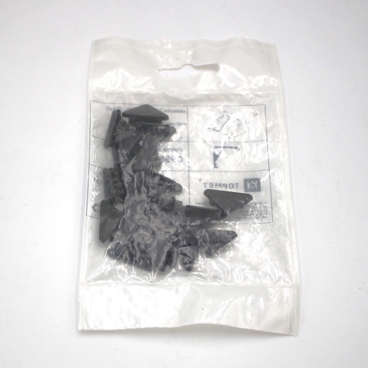 A clear plastic bag of multiple small, black, triangular End Cap for Cabi12 Profile pieces—perfect as LED channel accessories—placed on a white surface. The bag shows printed text and symbols that are visible but not easily readable.