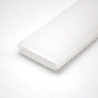 A close-up of the LED Channel Cover for KOZUS-BD Profile shows its white, rectangular plastic design with beveled edges, photographed against a plain white background—ideal for modern lighting solutions.