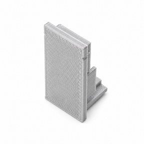 A small gray Plastic End Cap for Hannover Profile, 3D-printed and shaped like an open book, stands upright on a white background.