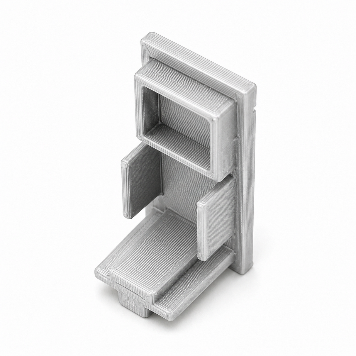A plastic Hannover Profile end cap with geometric cutouts and a layered texture, featuring two compartments and an angled base platform, is shown against a white background. Made in USA.