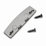 Here is a revised version using the provided product data: A flat, gray Aluminum End Cap for SLW10 Profile features three raised oval bumps, two circular indents, and two screw holes at each end. This European-made accessory comes with two black screws placed beside the end cap on a white background.