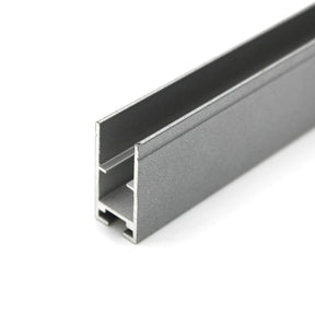 Close-up of the Edge-lit Acrylic Sign Base Channel ~ Model Hannover: a gray, rectangular aluminum profile with a lengthwise channel, ideal for mounting LED strips or supporting edge-lit acrylic signs in framing or construction projects.