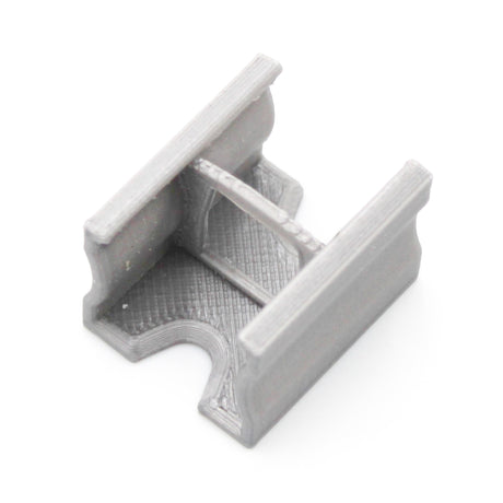 A compact gray Linear Connector for SL15 Profile, 3D-printed in PETG, with a U-shaped opening, squared edges, and central reinforcement bridge. Shown against a white background.