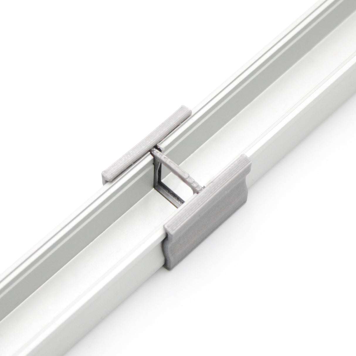 Close-up of a Linear Connector for SL15 Profile joining two aluminum extrusion profiles in a straight line on a white background—ideal for Slimline 15mm LED profiles.