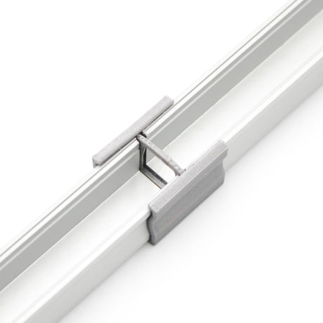 Close-up of a Linear Connector for SL15 Profile joining two aluminum extrusion profiles in a straight line on a white background—ideal for Slimline 15mm LED profiles.