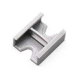 A compact, gray Linear Connector for SL7 Profile with a flat base, two parallel raised edges, and a central support bar, 3D printed and shown on a white background.