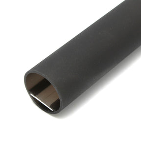 A close-up of black heat shrink tubing with a partially open end reveals its hollow interior, perfect for insulating and protecting wires—ideal for use with the Round Methacrylate LED Diffuser Tube ~ Model Oslo in various applications.
