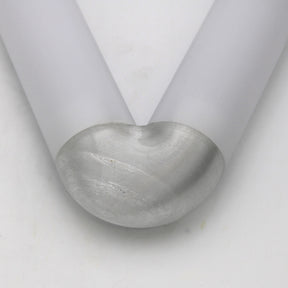 Two translucent PETG elbows for Oslo Profile, matte-finished and arranged in a V-shape on a white surface. One elbow ends with a semi-spherical, polished metallic cap.