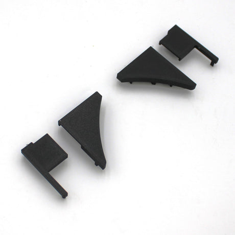 Four End Caps for Pula P10 Profile, made of black plastic in different shapes, are arranged in a row on a white background.