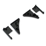 Four black End Caps for Pula P10 Profile are arranged on a white background, featuring small pegs and angled shapes—ideal components for assembling or joining structures with the Pula P10 edge-lit shelf profile.