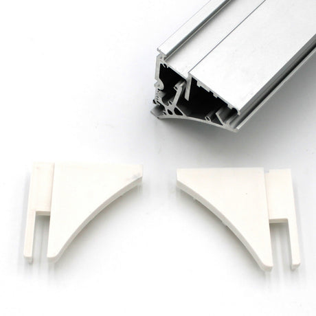 A silver end cap for the Pula P10 profile is shown above two white plastic corner brackets, all set against a plain white background.