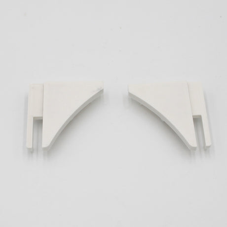 Two small, white, triangular plastic end caps with slotted ends sit side by side on a plain white background—perfect for finishing the End Cap for Pula P10 Profile made from durable PETG.