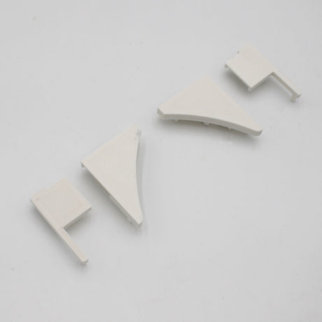 Four PETG end caps for the Pula P10 Profile, in assorted triangular and rectangular shapes, are displayed on a white surface.