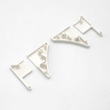 Four small, white End Caps for Pula P10 Profile, each with various raised notches and tabs, displayed in a row on a white background.