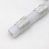 A Drop Ceiling T-Bar Clip for 1.5 Round Profiles, made of white plastic with two textured grip sections, is shown diagonally on a plain white surface.