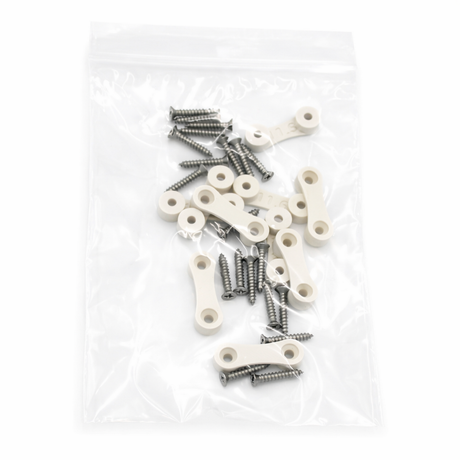 A clear plastic bag containing several small beige LED Strip Saddles and silver screws, arranged loosely inside the bag on a white background.