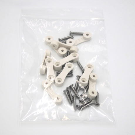 Clear plastic bag containing several LED Strip Saddle white plastic connecting pieces, silver screws, and surface mount accessories on a white background.