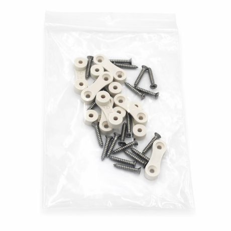 A clear plastic bag containing several metal screws, small beige plastic brackets, and surface mount accessories for the LED Strip Saddle, all arranged loosely inside.