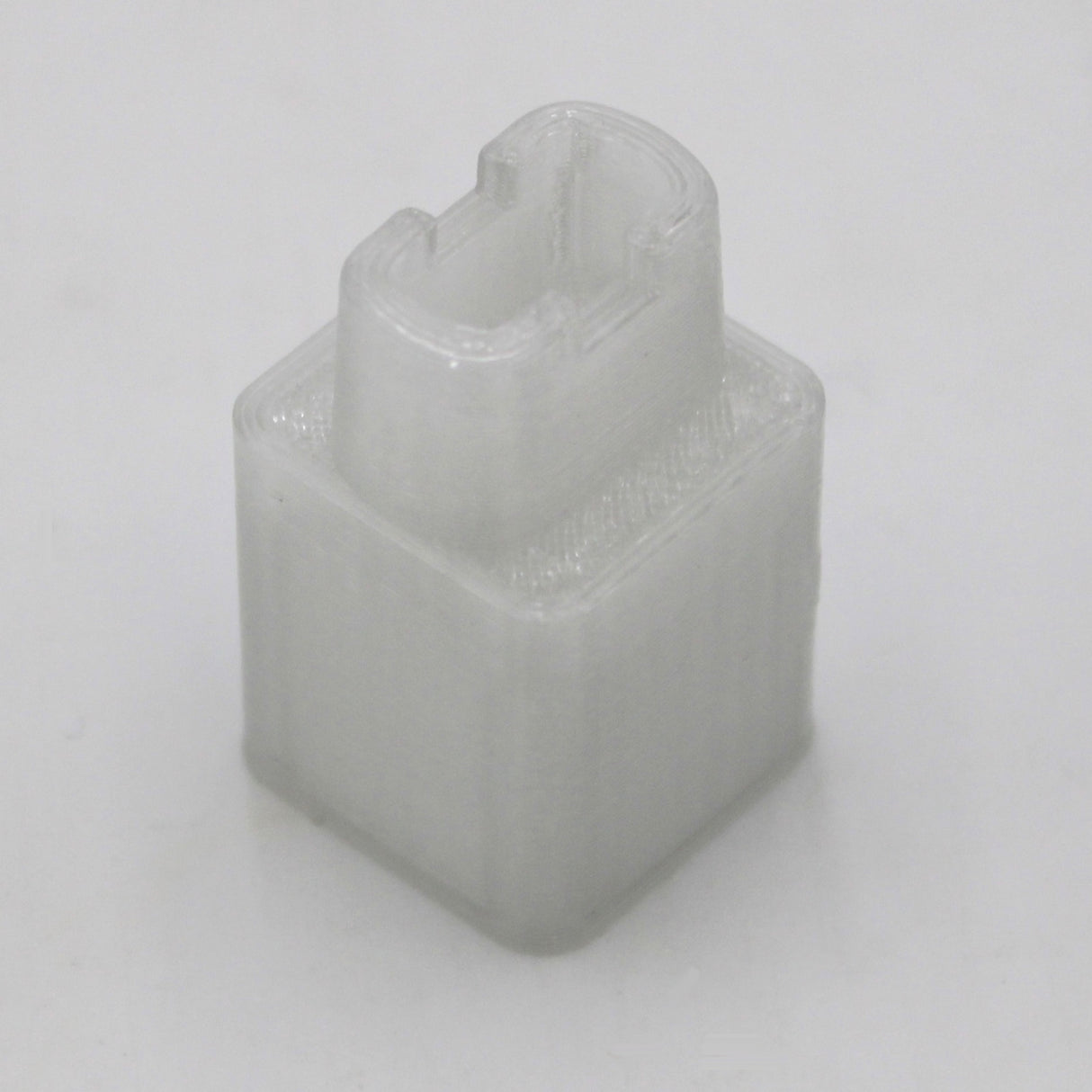 The Square Tube Light Adaptor is a small, translucent, rectangular 3D-printed plastic piece with a hollow U-shaped notch on top, designed for fluorescent tube replacement. It is shown on a plain white background.