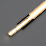 A close-up of a glowing COB IP20 Dotless LED Strip (24V) ~ UniBasic Series with a clear cover, displaying the strip’s wiring and printed technical details on a grey background.