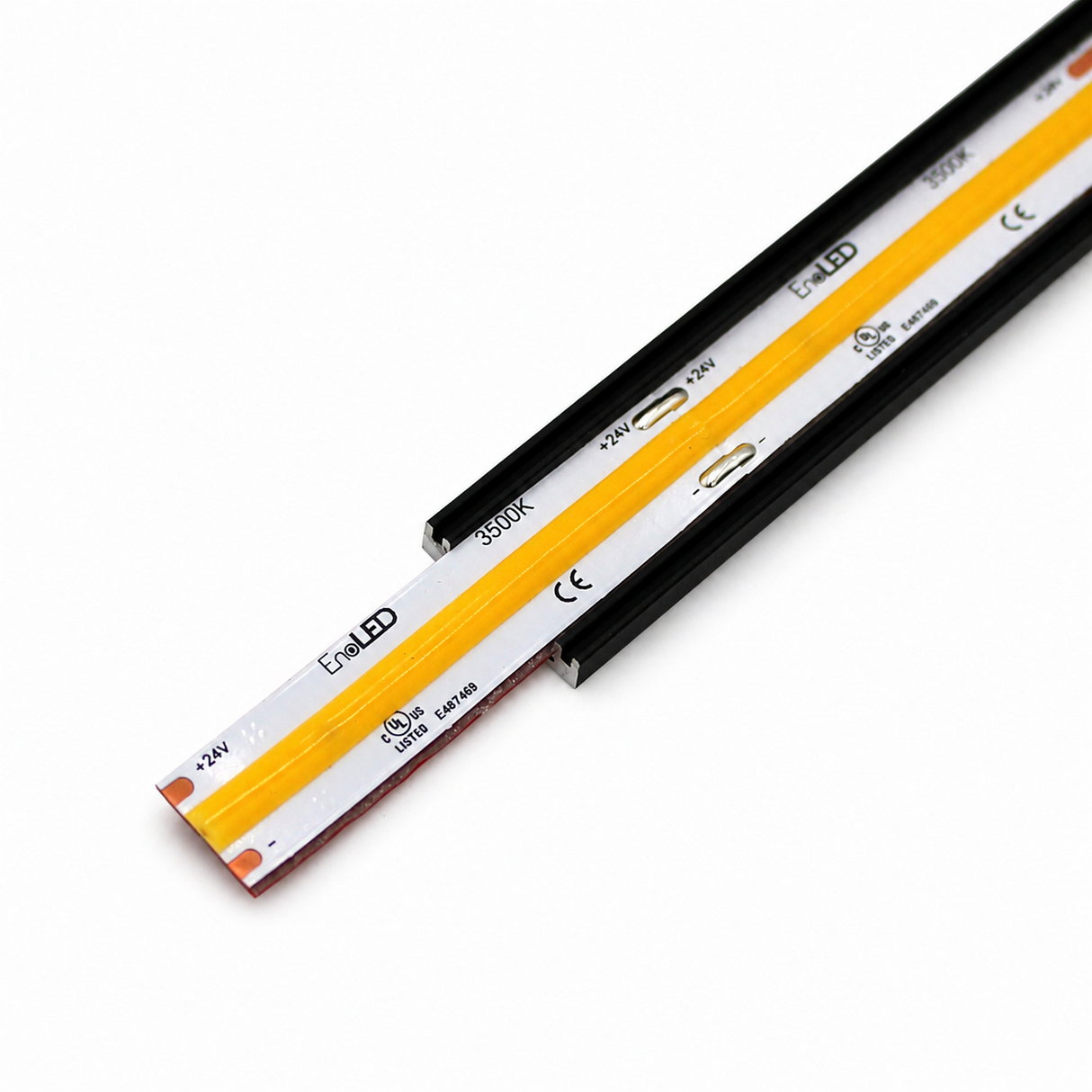 Close-up of the COB IP20 Dotless LED Strip (24V) ~ UniBasic Series featuring a yellow light-emitting section on a white base, labeled with technical details and certification marks, displayed on a white background.
