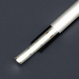 A close-up of the COB IP20 Dotless LED Strip (24V) ~ UniBasic Series illuminated inside a metallic or plastic channel with a frosted cover, set against a dark gray background.