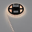 A coiled reel of High CRI RGBW IP68 Waterproof LED Strip (24V) ~ Iris Series is partially unspooled and glowing warm white. The label displays the brand WAS and an expiration date of 11/29/2024.