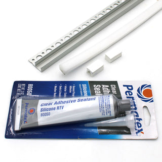 A RGB LED Tile Edge Light Strip Kit (24V) ~ Nicho Series is displayed alongside two white plastic strips, two white rectangular end caps, a white perforated metal strip, and an aluminum LED channel—perfect for securing your waterproof lighting.