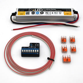 The Blebox Hard-wired Power and Control Kit (24V) includes a rectangular EnoLED PicoDrive 24V LED driver, terminal block, red and white wiring, and five orange wire connectors—ideal for precise lighting or use with a Blebox controller.
