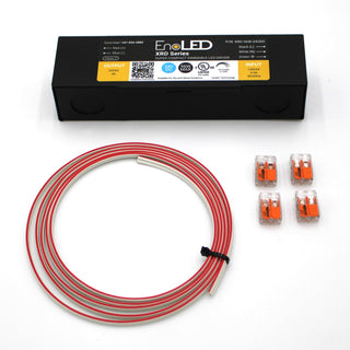 The AC Dimmable Hardwired LED Driver Kit (24V) ~ EnoLED XRD, with coiled red/white wires and four orange-transparent connectors, is neatly displayed on white—perfect for use with LED strip lights or wall dimmers.
