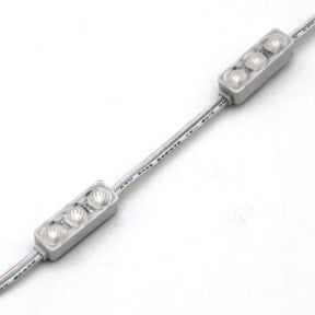 A close-up of the Mini3 Color 160 Mini LED Module ~ Wide Angle Series, IP68 waterproof, shows three LEDs per rectangular module linked by white wire, each with a wide-angle lens, arranged on a white background.