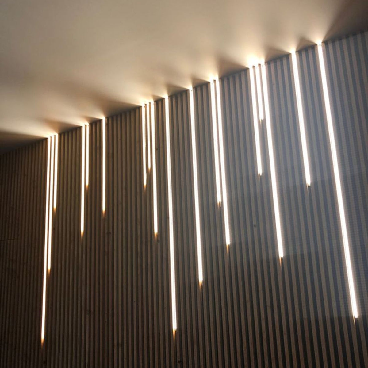 LED strip lighting integrated into architectural wood slats
