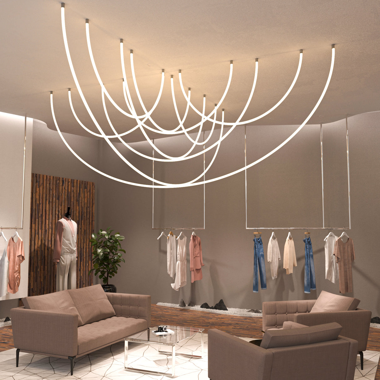 Modern boutique with neutral-toned sofas, a glass coffee table, and stylish clothing displays. Flexible White LED Neon Tube ~ Neon 360 Series provides 360° illumination, forming artistic patterns that enhance the elegant, minimalist interior.