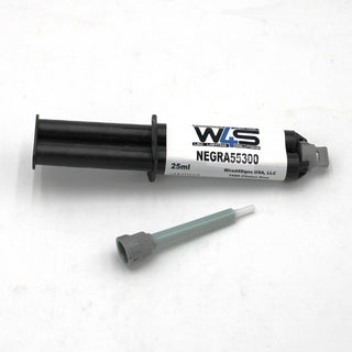 A black 25ml syringe labeled “W4S 55300” (Black 2-part Methacrylate Adhesive, 1:1 Mix B-System) by WireSings USA, LLC for industrial bonding is on a white surface with a separate gray and green mixing nozzle below.
