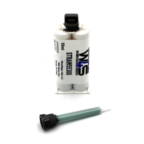 A Cream 2-part Methacrylate Adhesive ~ W4S 55300 (50ml 1:1 Mix B-System) stands upright with a separate green and black mixing nozzle in front, ideal for bonding, on a white background.