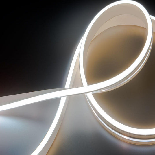 The White IP44/IP66 Neon Flexible LED Light Line (24V) ~ Flex Ultra Slim Series creates smooth, glowing curves with soft highlights and shadows, ideal for architectural lighting on dark backgrounds.