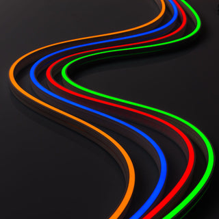 Pixel IP44/IP66 Neon Flexible LED Light Line (24V) ~ Flex Super Slim Series strips in orange, blue, red, and green create parallel waves on a glossy black surface, highlighting the vivid effects of addressable LED lighting.