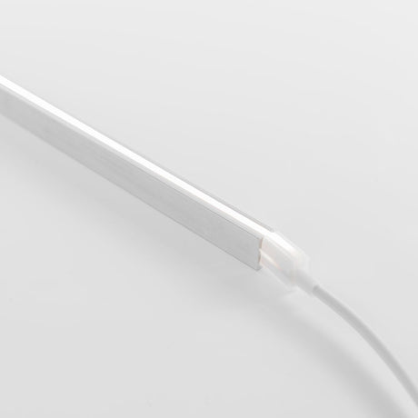 A slim, rectangular LED light bar with a white frame and power cable is shown on a white background, highlighting its compatibility with the Mounting Clips for Neon Flex Ultra Slim Series for easy installation.