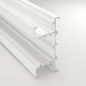 A close-up of the Up & Down Wall Feature Lighting LED Profile ~ Model New Washington, a white extruded aluminum profile with multiple grooves and channels, ideal for architectural accents or LED strip integration, shown isolated on a light background.