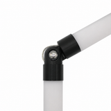 Close-up of a white diffuser tube system connected to another tube at an angle with a black and silver Hinge for Oslo Mini Profile, against a plain white background.
