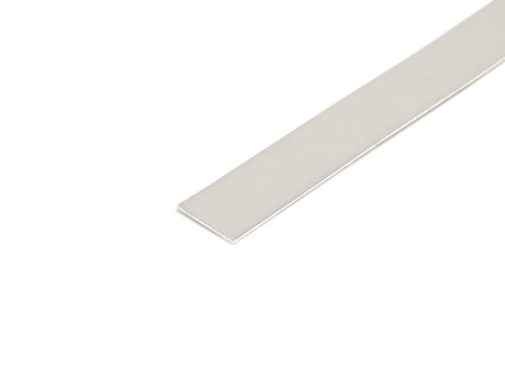 A flat, rectangular LED Mounting Plate for Oval20 Profile with a smooth, shiny aluminum surface is displayed diagonally from bottom left to top right against a white background.