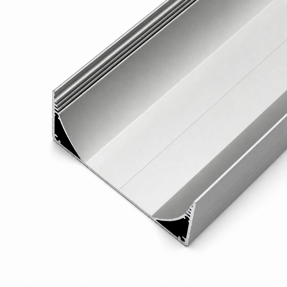 A close-up of the 3.15″ Surface Mount LED Strip Channel (Model PLW80N), crafted from silver, rectangular anodized aluminum with a hollow center, smooth surfaces, and sharp edges, is displayed on a white background. This versatile profile is designed for use as a surface mount LED strip channel and can accommodate an LED DOT FREE frosted diffuser to ensure uniform illumination.