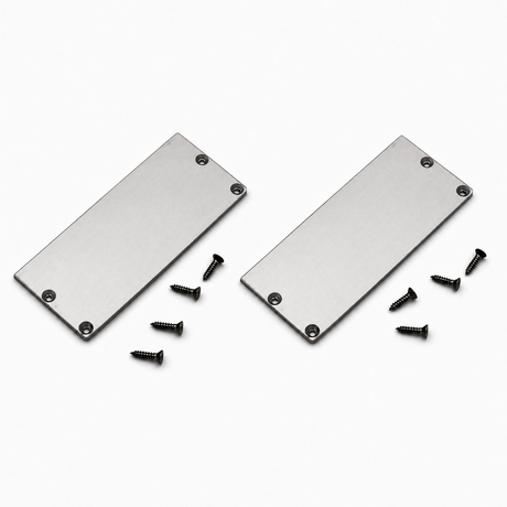 Two Aluminum end caps for PLW80N LED profile w/out cable hole, each with four screw holes, are positioned side by side on a white surface. Eight black screws are scattered nearby, with four placed near each end cap.