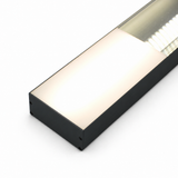 A diffuser designed for PLW80N, RPLW80, RPLW80-FL, and Alu-Triangle series profiles is featured here with a black metal frame and frosted cover, emitting bright white light; the rectangular LED fixture is photographed from an angle against a white background.