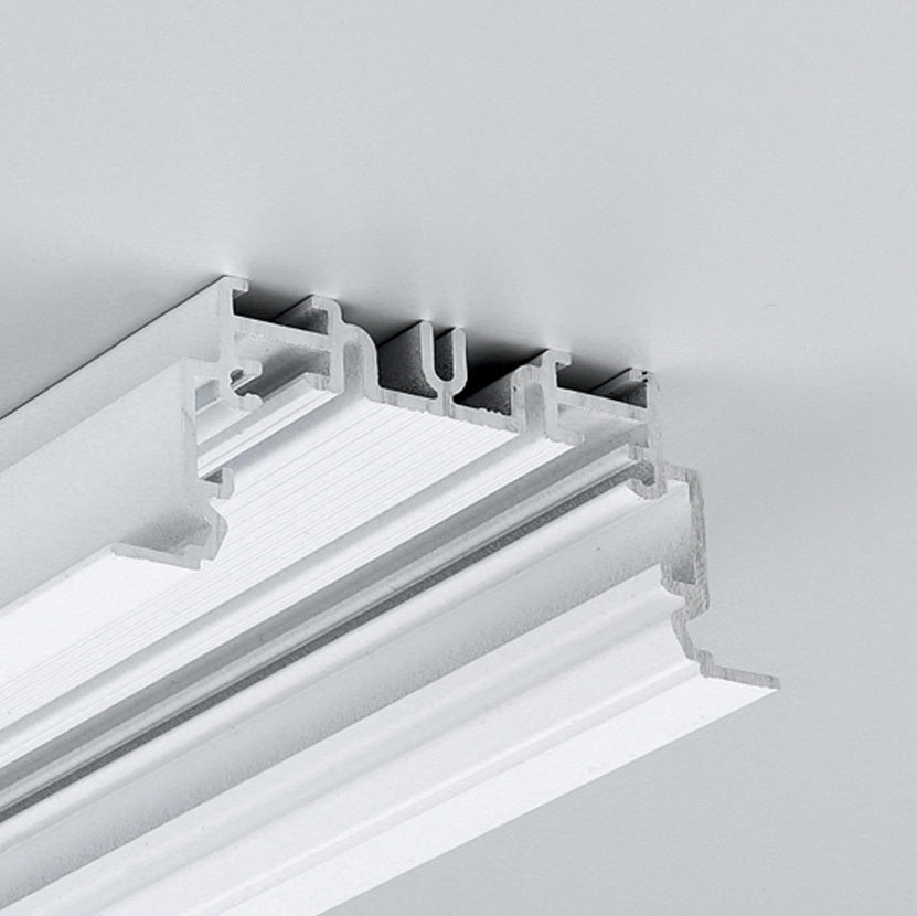 Close-up of the 2" Recessed Easy-Mounting LED Strip Channel ~ Model Phil.v2 Recessed, shown with a white decorative ceiling molding featuring layered grooves, seamlessly installed in a light gray ceiling for smooth LED strip integration.