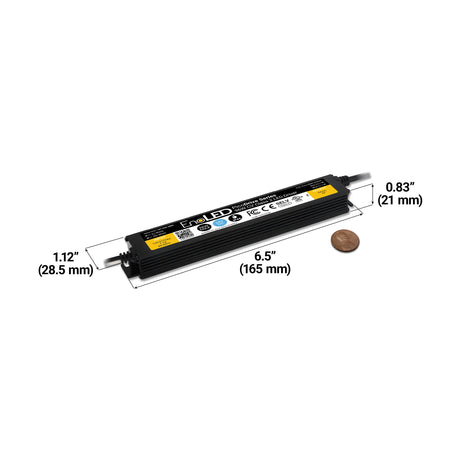 The Slim Class 2 LED Driver (24V) ~ EnoLED PicoDrive Series is shown with a penny for scale. This energy-efficient unit measures 6.5" (165 mm) L x 1.12" (28.5 mm) W x 0.83" (21 mm) H, with dimensions clearly labeled.