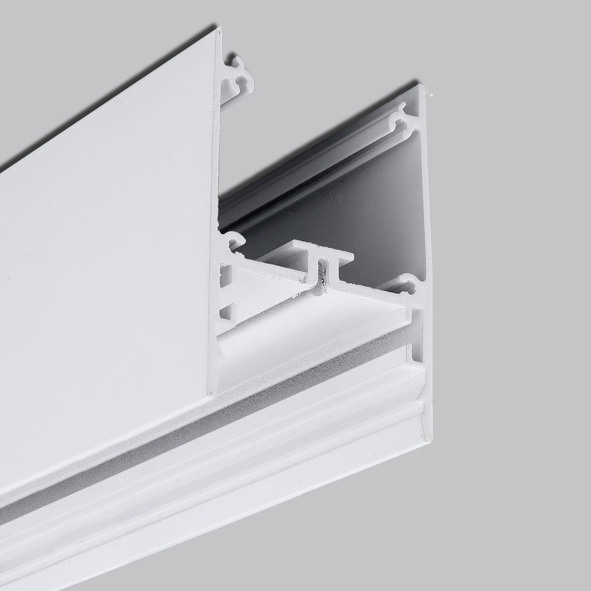 Close-up of a 1.76″ Suspended/Surface Mount LED Channel ~ Model Pixel33-02 with grooved white aluminum finish, set against a gray background. Ideal for construction or architectural lighting applications.